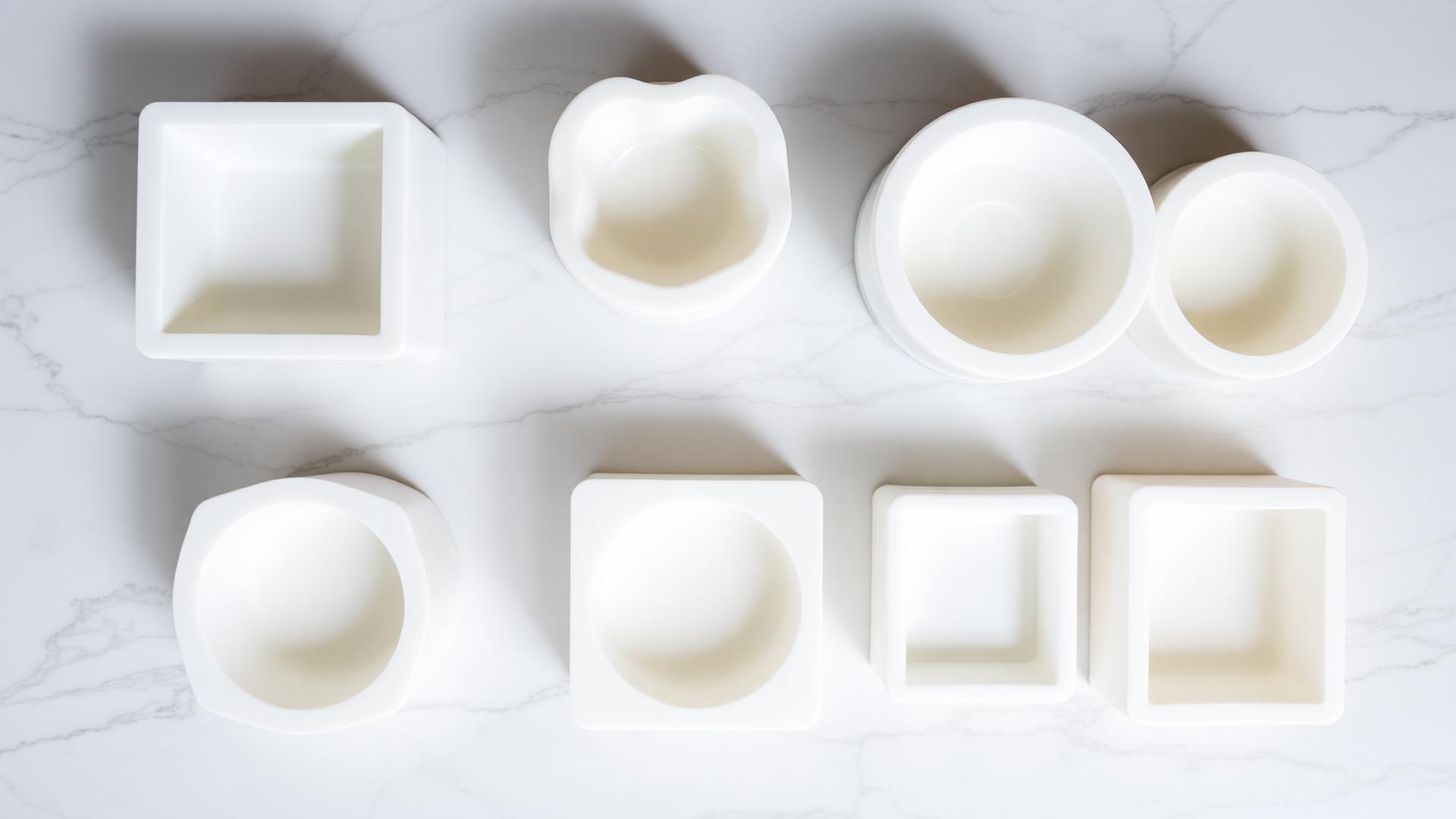 Premium silicone molds for candle, soap, and resin making arranged on marble